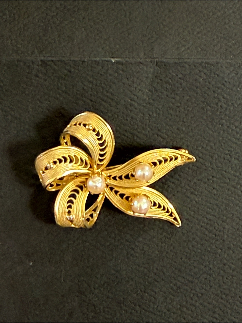 vintage MCM Gold-toned filigree bow brooch with three faux pearls